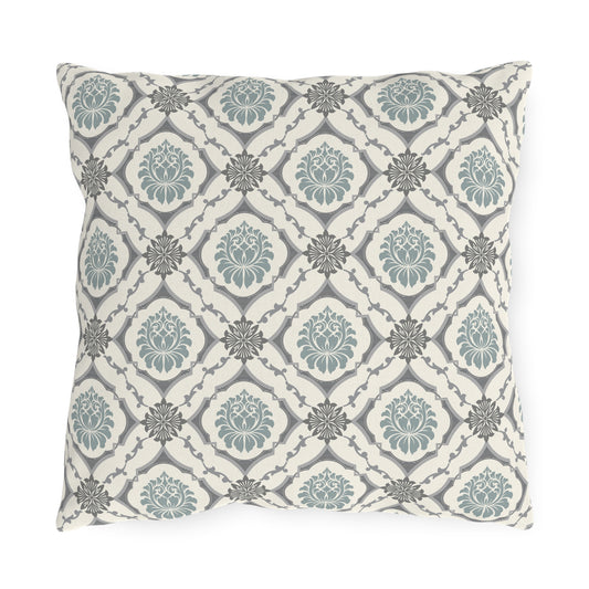Outdoor throw pillow with centered slate blue tile lattice pattern on light base