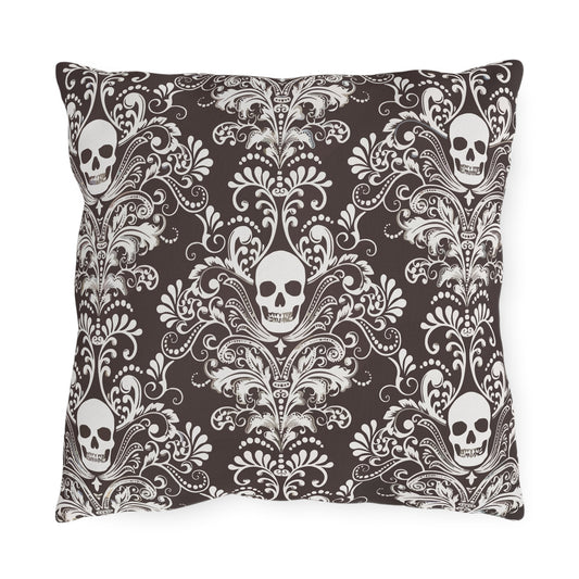 Outdoor throw pillow featuring a dark brown backdrop with white skull damask design