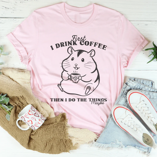 Pink graphic T-shirt with cat holding coffee and bold slogan text print
