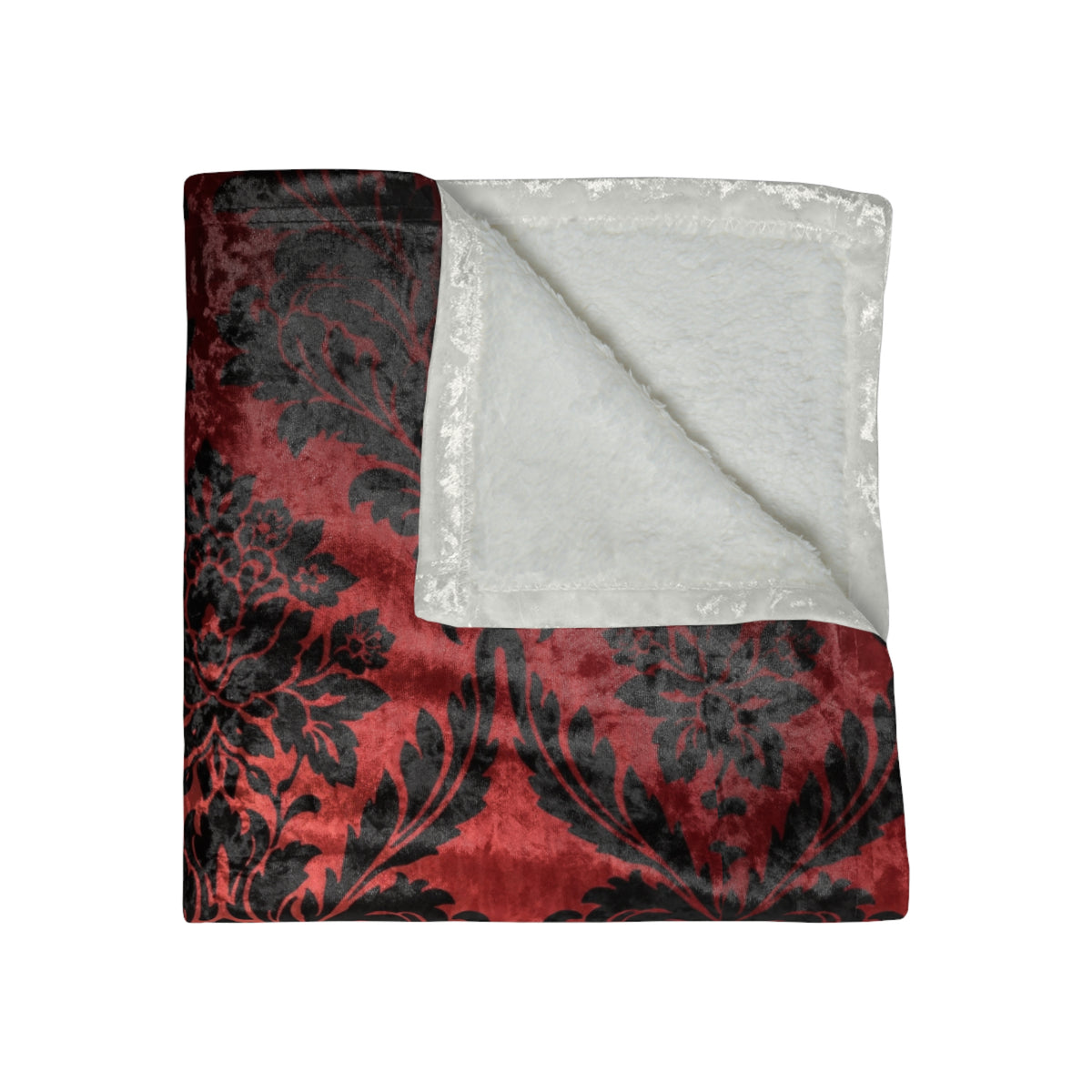 Folded throw blanket: red and black damask floral front, white underside
