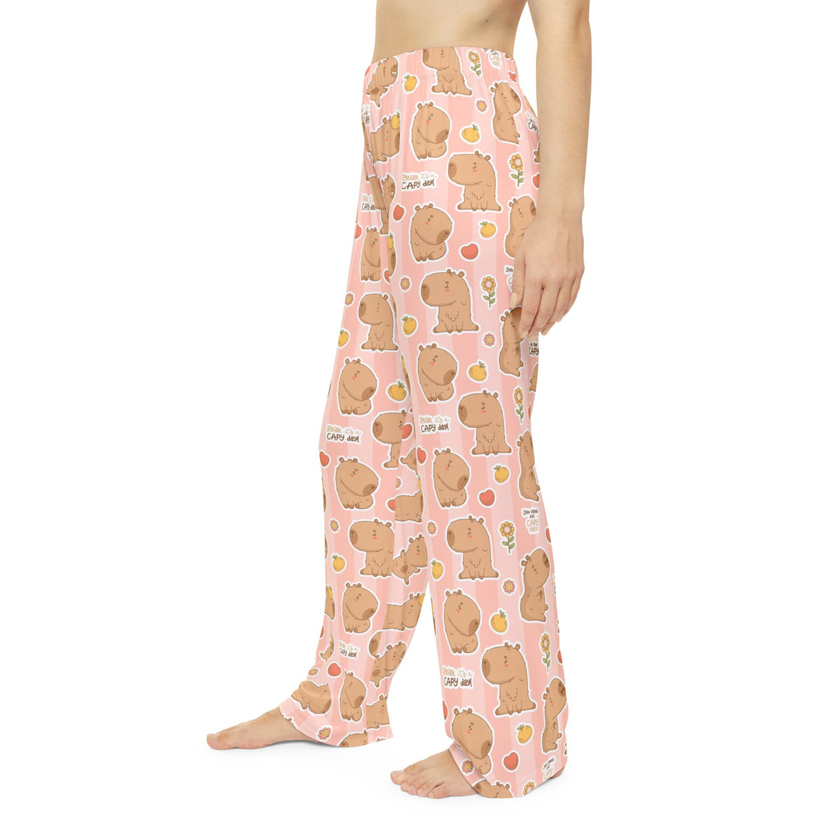 Women's pajama pants in pink, capybara print, side view of relaxed legs