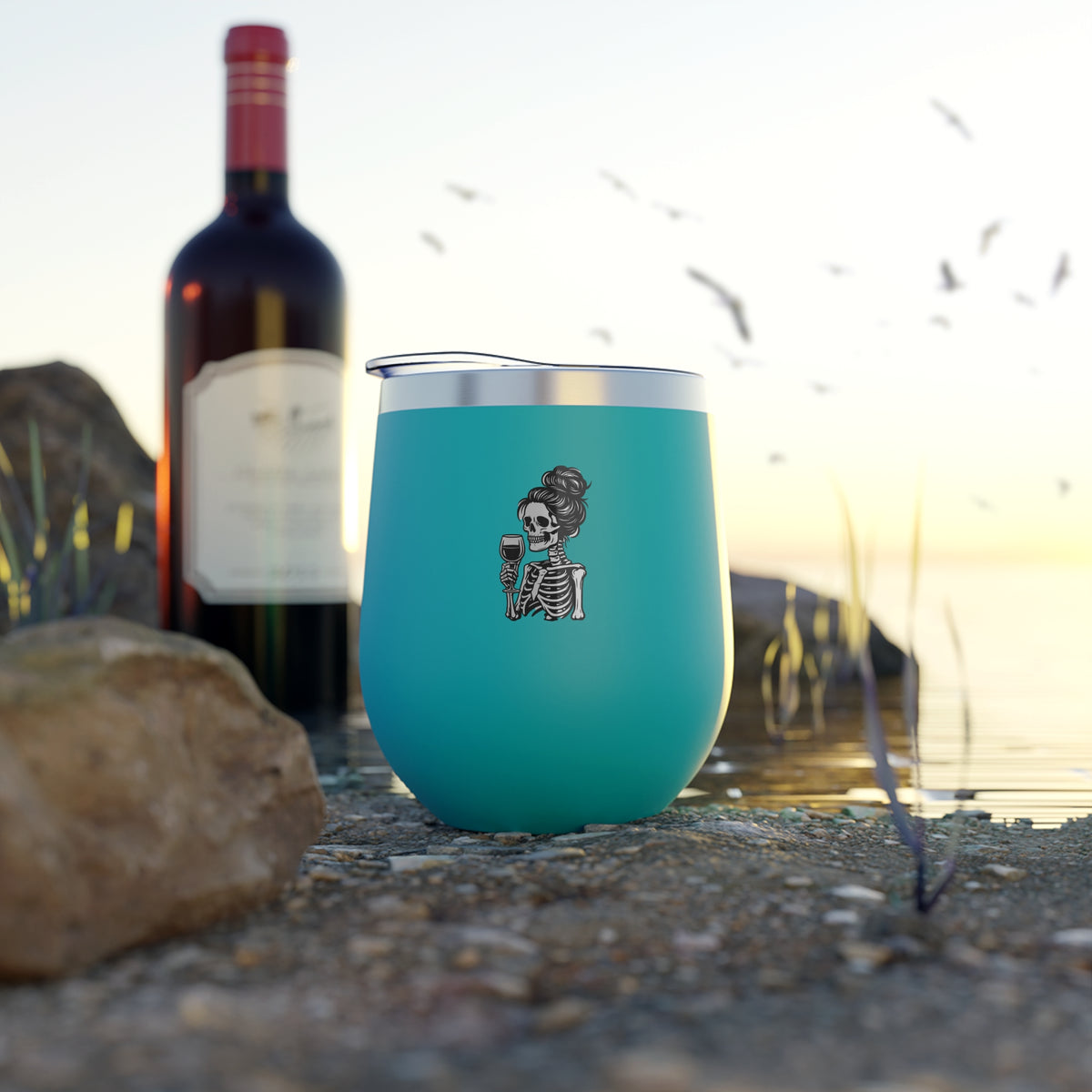 Turquoise 12oz tumbler with skeleton holding wine glass graphic on front