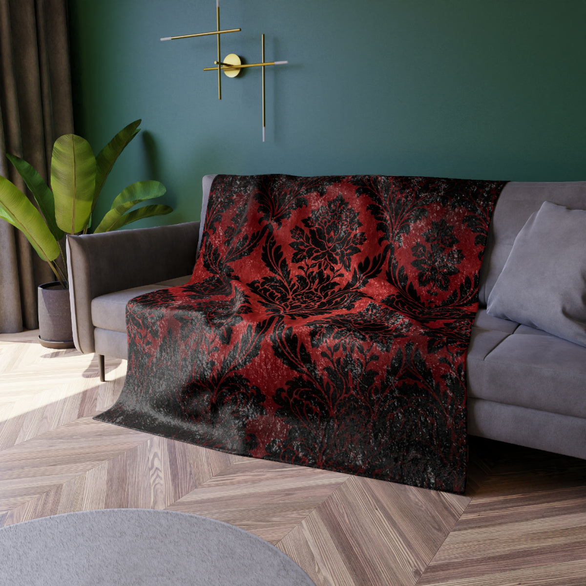 Red and black damask floral throw blanket draped on sofa