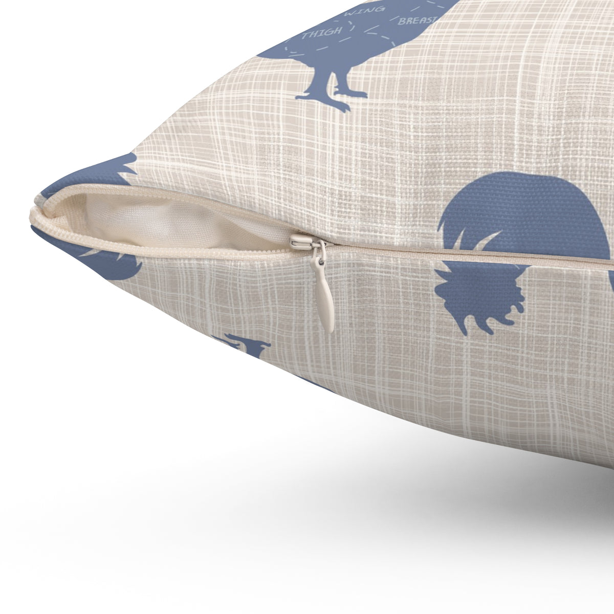 Rooster-pattern pillow with cream fabric, navy print, and zipper opening on side seam