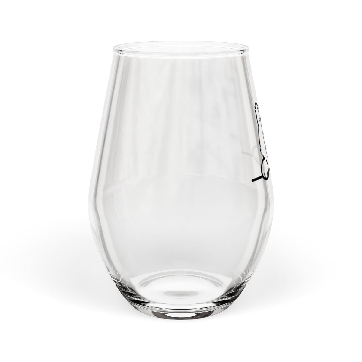 Clear stemless wine glass with black cat peek illustration partially visible on side