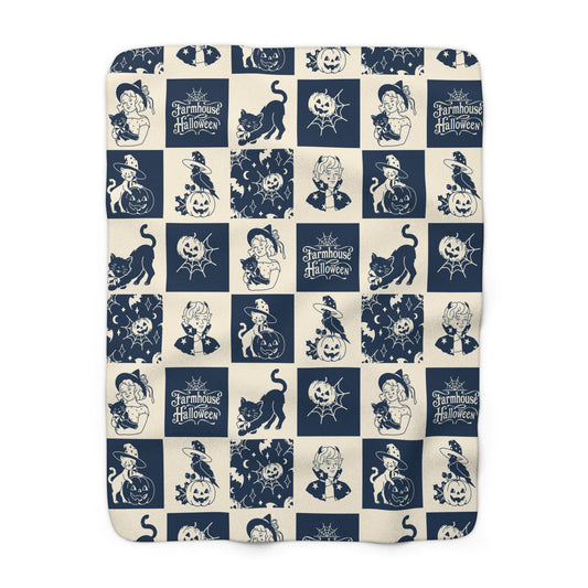 Navy-and-cream Halloween patchwork sherpa blanket with cats, pumpkins, witches, and bats