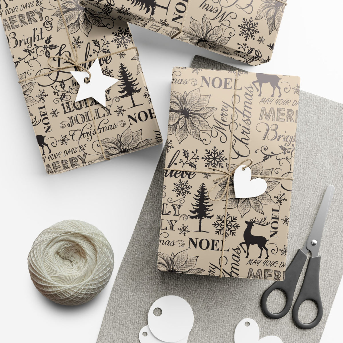 Christmas gift wrap paper sheets, cream with black Noel/Believe text pattern; gift tags and scissors