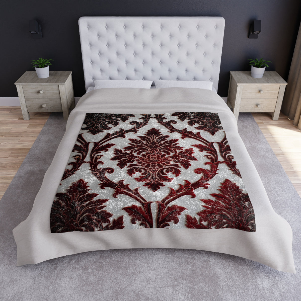 Damask throw blanket on bed with dark red floral medallion and scroll motifs