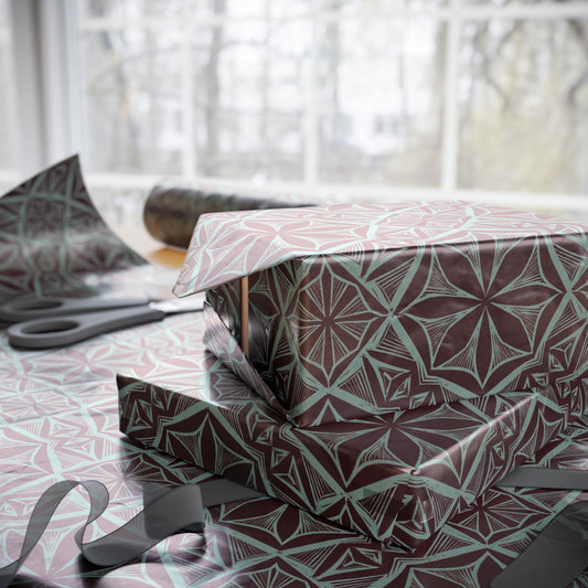Geometric starburst wrapping paper roll in burgundy and teal, folded sheets stack view