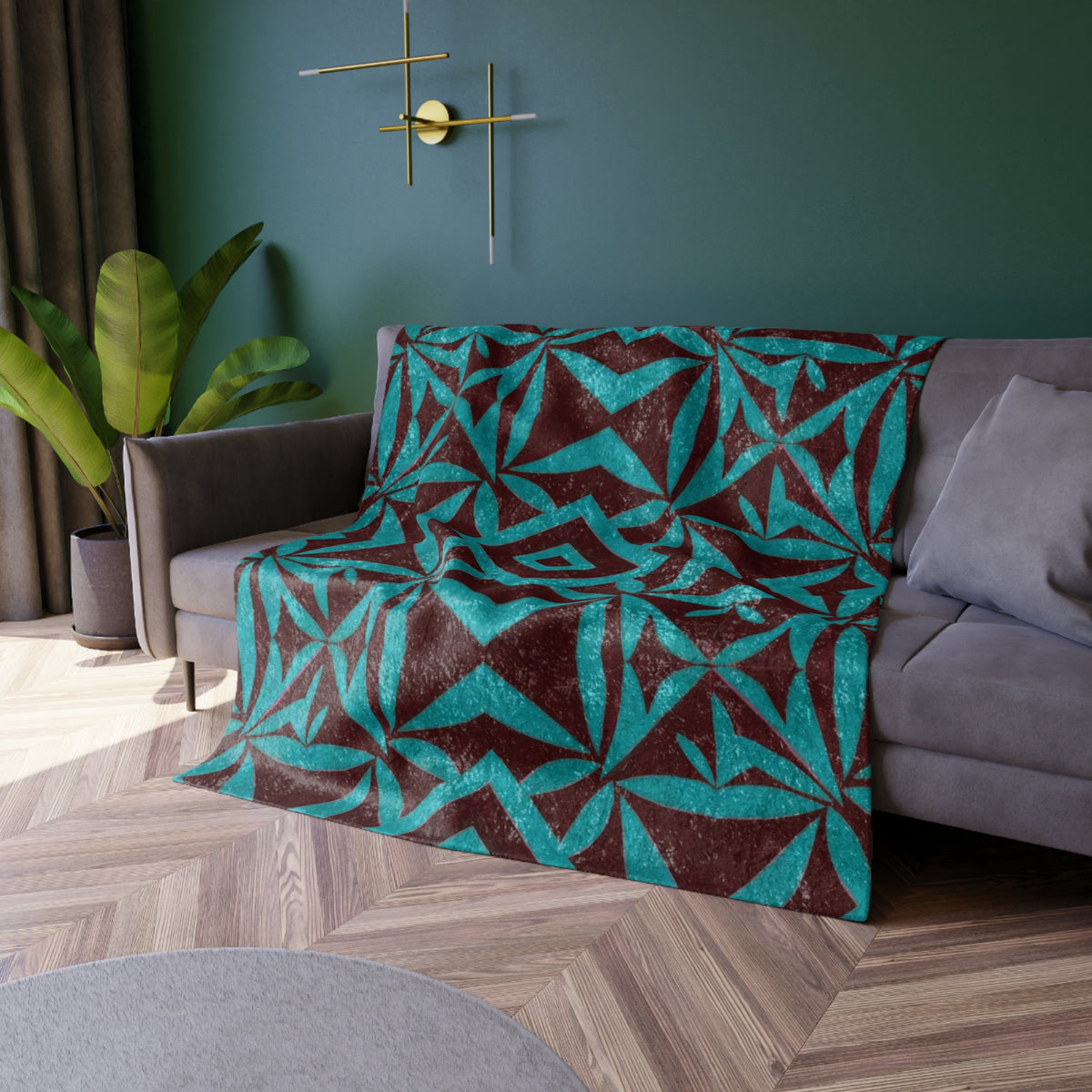 Crushed velvet blanket laid over chair arm, teal geometric pattern on dark brown