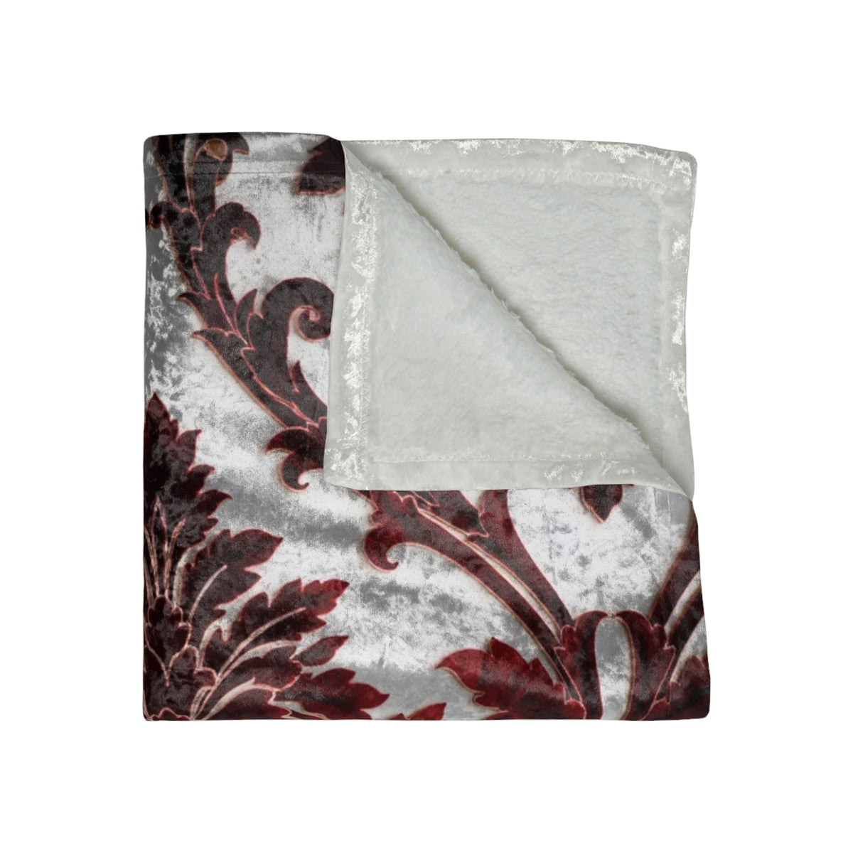 Ivory and dark red damask throw blanket, folded with floral scroll pattern