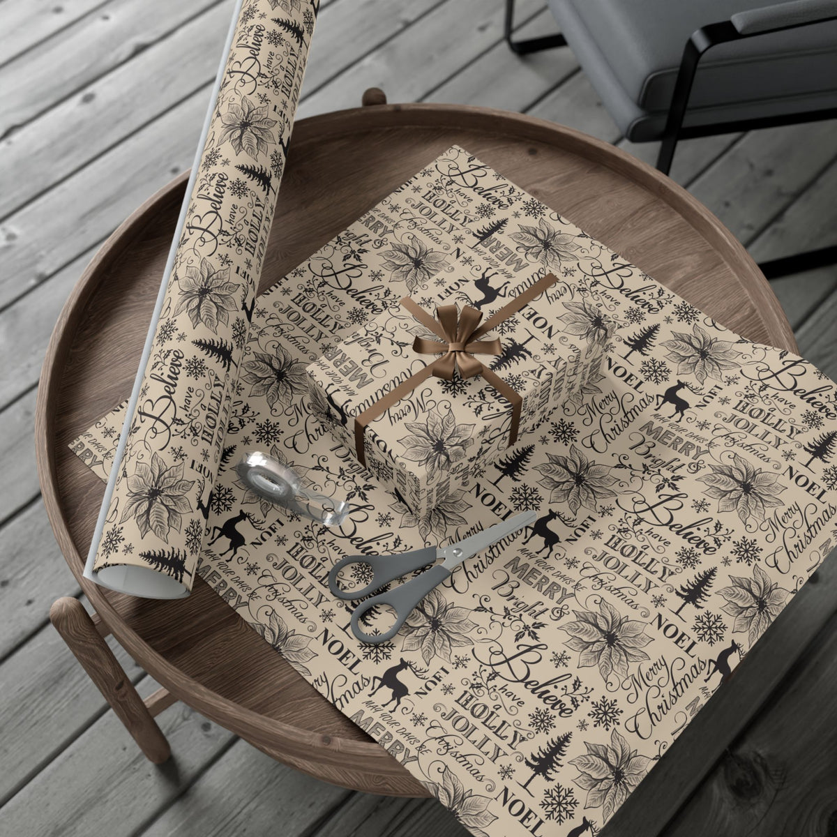 Vintage Christmas typography gift wrap paper folded over a gift, beige with black holiday print