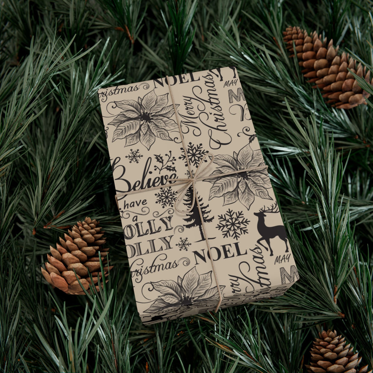 Christmas gift wrap paper, cream with black Noel and Believe lettering, holly, pine, reindeer prints