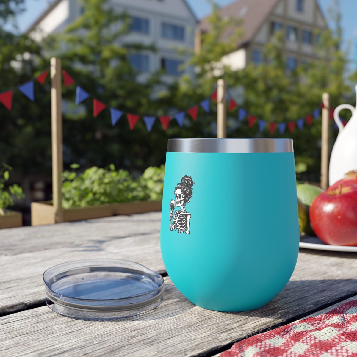 Turquoise 12oz tumbler with skeleton holding wine glass graphic, open lid