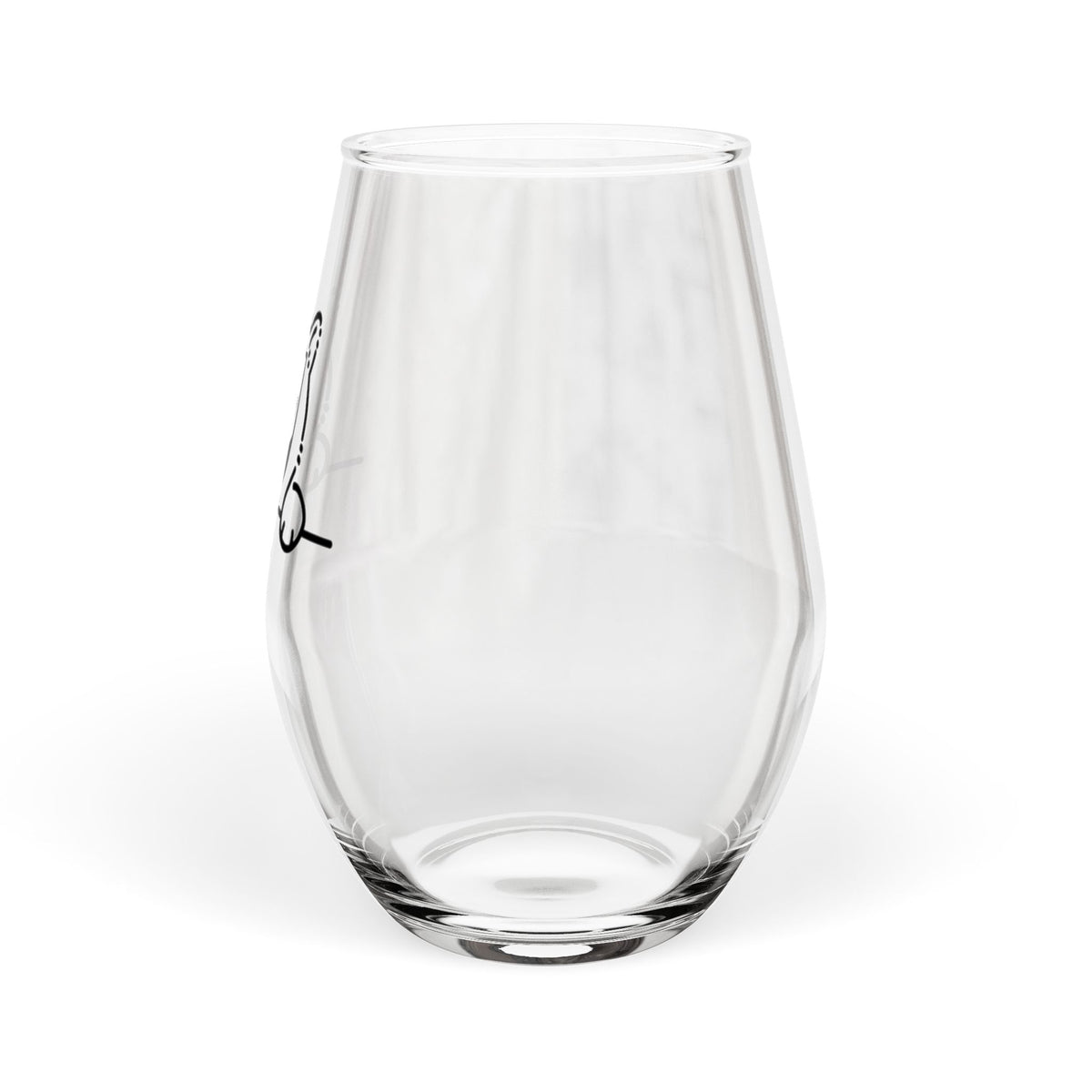 Clear stemless wine glass with black cat peek illustration on side, angled view