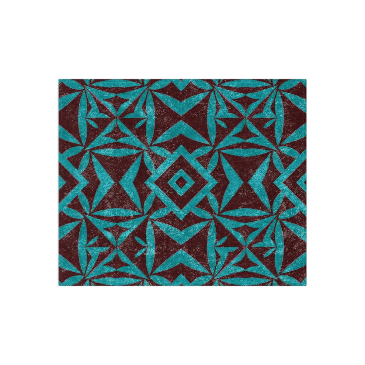 Crushed velvet blanket swatch with teal geometric motifs on dark brown base