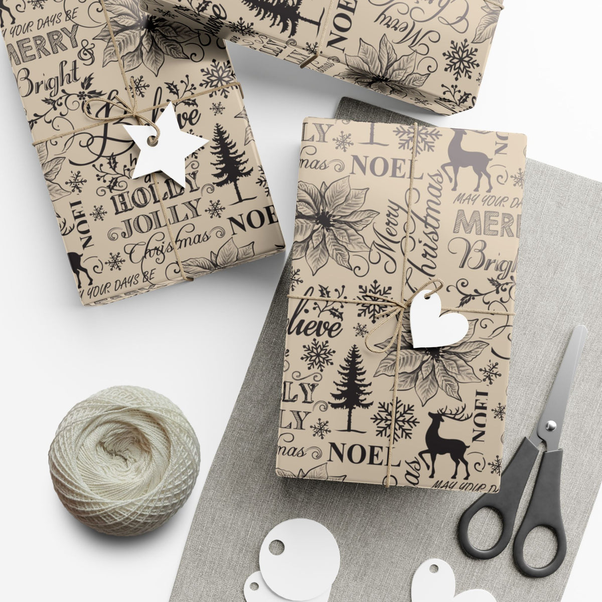 Christmas gift wrap paper set, cream with black typography and icons; gift tags and twine shown