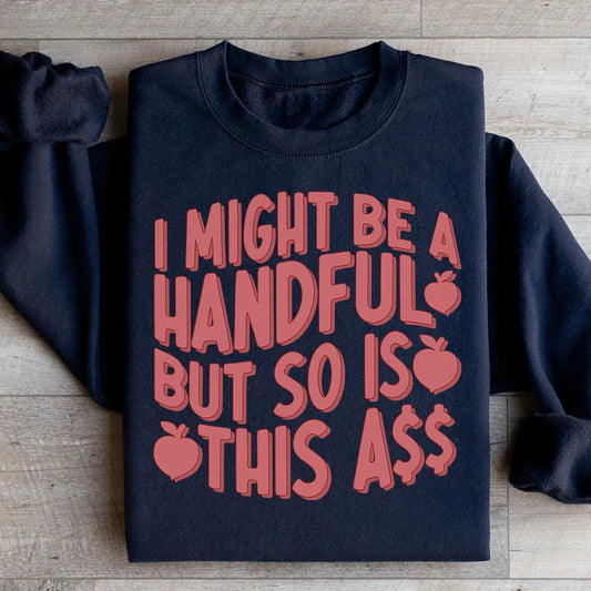 Black crewneck sweatshirt with large red apple text graphic and long sleeves