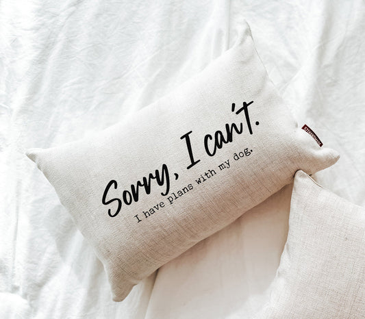 Cream linen throw pillow with 'Sorry, I can't. I have plans with my dog' text